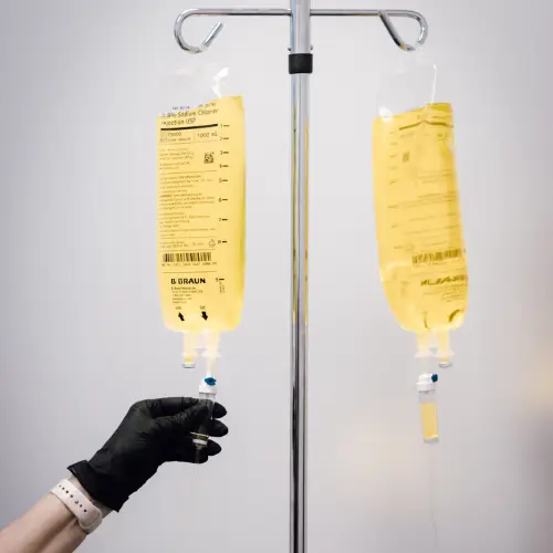 IV infusion bags on a stand.