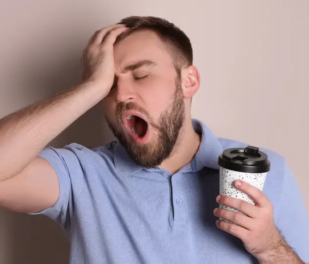 A men looking tired and resting her head, representing common low energy and chronic fatigue concerns.